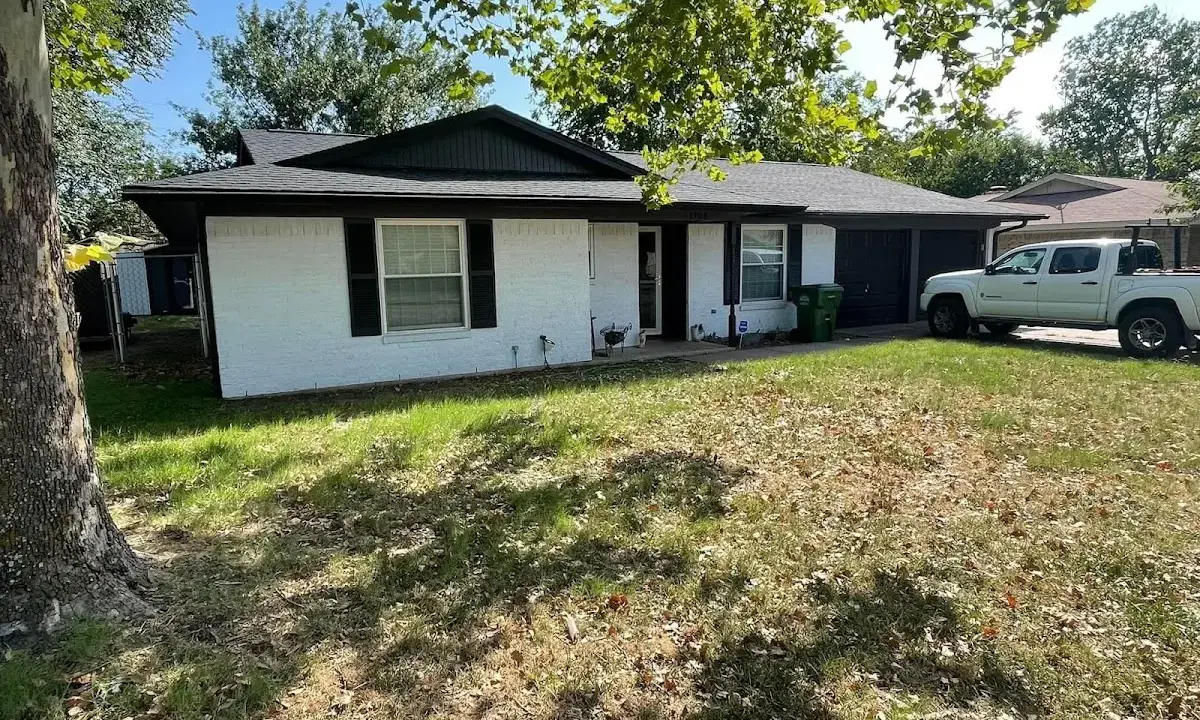 Professional roofing crew working on a residential roof in Springfield